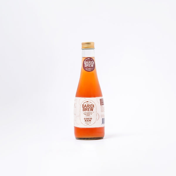 A bottle of Coco Rain, a cold tea infusion in kenya, with a purple label on a white background.