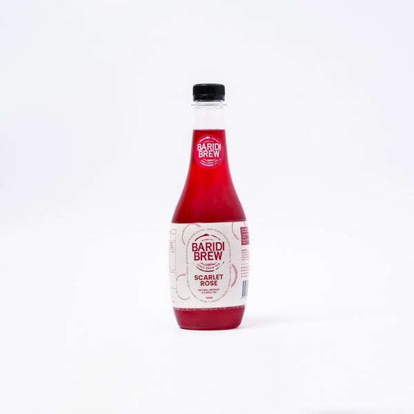 A 500 ml  bottle showing, an iced tea in kenya in color maroon with a clean white background.