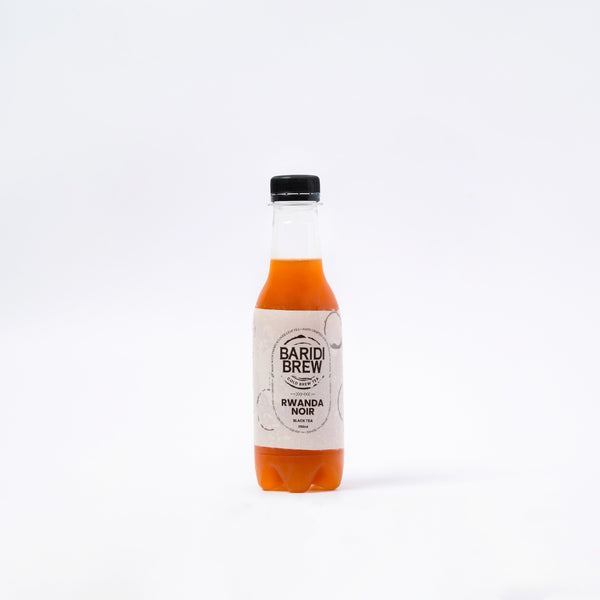 A 250 ML bottle of Rwanda Noir, an Iced Black Tea in Kenya, with a label that includes the product name and the brand, Baru Brew.